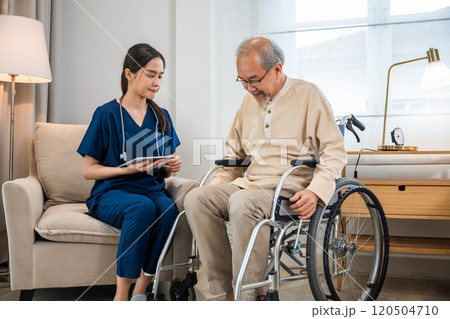 Asian woman doctor nursing holding digital tablet with patients chart while talking and explain for results of treatment to patient old man sitting in wheelchair, Health care and medical Asian woman doctor nursing holding digital tablet with patients chart while talking and explain for results of treatment to patient old man sitting in wheelchair, Health care and medical 120504710