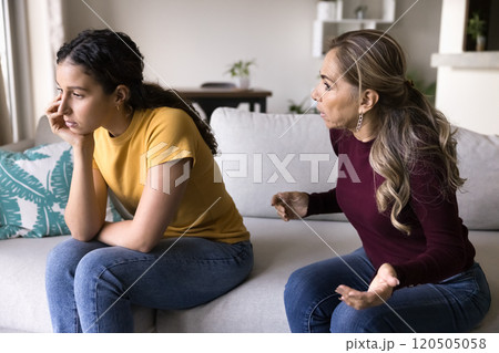 Annoyed senior Latin mom arguing with ignoring stubborn daughter woman 120505058