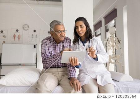 GP showing to patient health condition test result on tablet 120505364