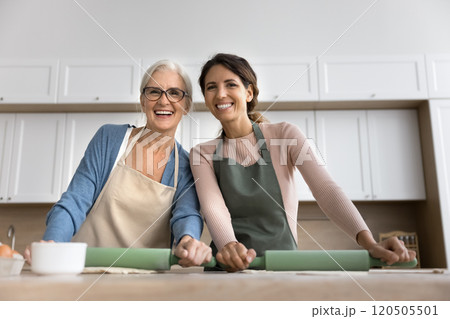 Multigenerational family women engage in culinary at home 120505501