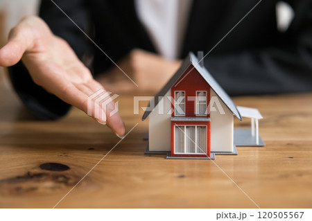 Female real estate agent offering new build property Female real estate agent offering new build property 120505567