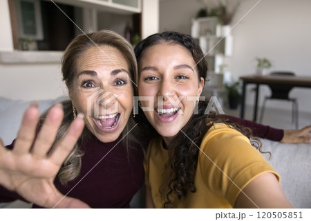 Senior Latin mother and daughter posing for close up portrait 120505851