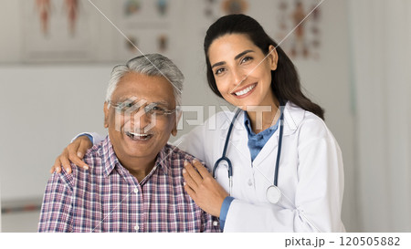 Portrait of happy older man and nurse posing for camera Portrait of happy older man and nurse posing for camera 120505882