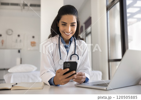 Doctor consultinf patient via smartphone telehealth mobile application 120505885