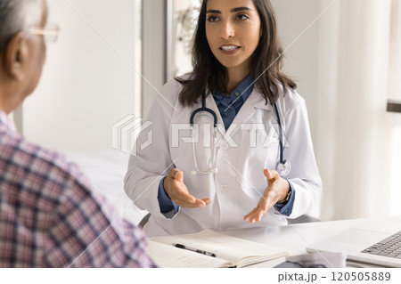 Male patient listens health recommendations of young Latina GP professional Male patient listens health recommendations of young Latina GP professional 120505889