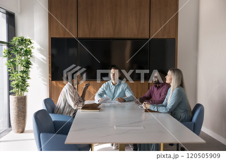 Multiethnic company staff brainstorming on marketing strategy 120505909