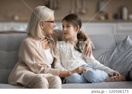 Grandmother leading pleasant trustworthy conversation with granddaughter Grandmother leading pleasant trustworthy conversation with granddaughter 120506173
