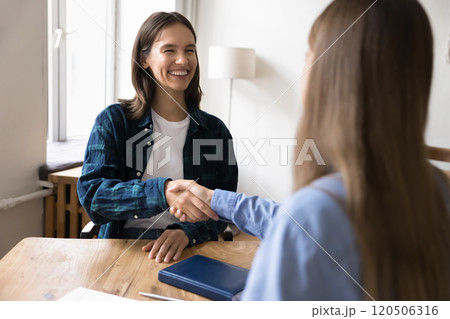 Female applicant shaking hand HR manager, passed job interview successfully 120506316