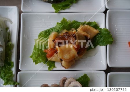 Fresh raw sea squirt served on a white plate 120507733