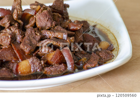 Close up view of delicious pork cooked in soy sauce. Asian food concept 120509560