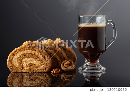 Dessert with walnuts and coffee on a black reflective background. Dessert with walnuts and coffee on a black reflective background. 120510956