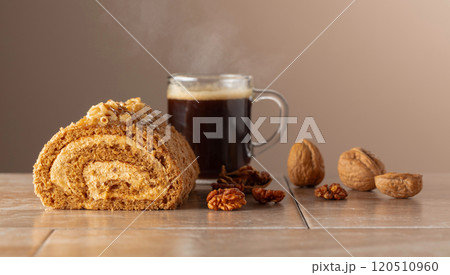 Dessert with walnuts and coffee on a beige background. 120510960