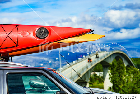 Car with canoes on top roof in mountains Car with canoes on top roof in mountains 120511327