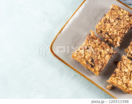 Baked oatmeal peanut butter banana cake bars with chocolate chips Baked oatmeal peanut butter banana cake bars with chocolate chips 120511398