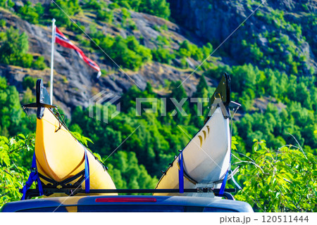 Car with canoe on top roof in mountains Car with canoe on top roof in mountains 120511444
