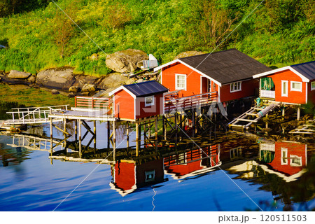 Norwegian fishing village red huts, Reine Lofoten Norway Norwegian fishing village red huts, Reine Lofoten Norway 120511503