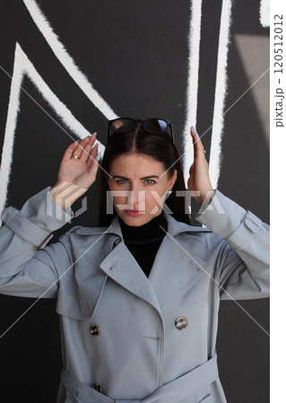 young pretty brunette woman posing emotional outside on neutral background 120512012