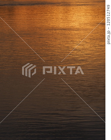 Reflection of a sun set in Rhine River near Stein am Rhein in Switzerland - vertical Reflection of a sun set in Rhine River near Stein am Rhein in Switzerland - vertical 120512749