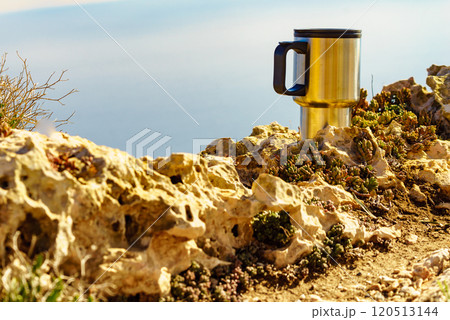 Thermal mug, thermos on nature. Travel outdoor picnic. 120513144