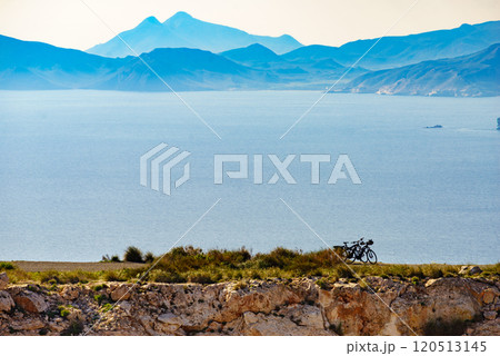 Coast view with two bicycles on shore 120513145