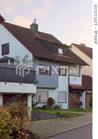 A Serene Countryside Home Bathed in the Warm Glow of Sunset, Inviting Harmony and Comfort 120513158