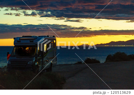 Camper on coast at sunset Camper on coast at sunset 120513629