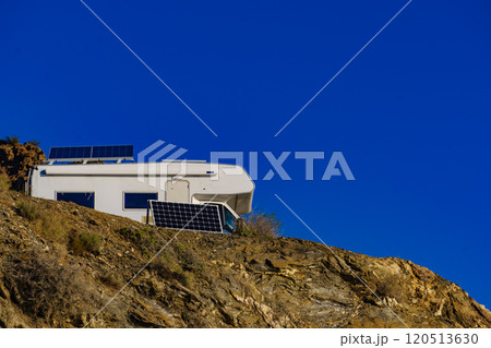 Caravan with tilt solar panels on roof. 120513630