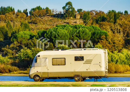 Rv caravan on lake shore. Autumn time. 120513808