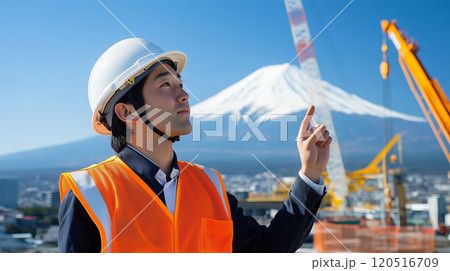富士山と作業現場で指示を出す日本人作業員 120516709