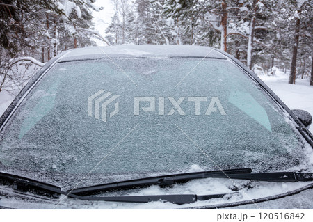 Car Covered with Snow in Winter Forest 120516842