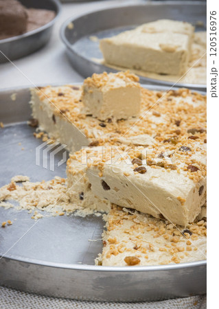 Halva with nuts on stall at bazaar. High calorie snack 120516976