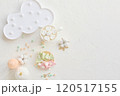 Charming pastel-colored dessert setup featuring marshmallows, a cloud plate, and decor on a white background. 120517155