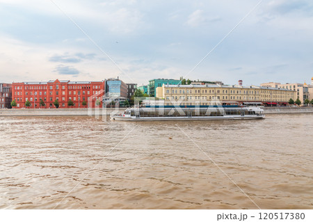 Cruise ship sails on the Moscow river in Moscow city center, popular place for walking. Cruise ship sails on the Moscow river in Moscow city center, popular place for walking. 120517380