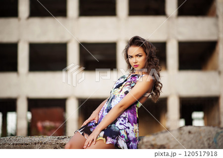 Portrait of a beautiful model posing in evening light measure concrete wall Portrait of a beautiful model posing in evening light measure concrete wall 120517918
