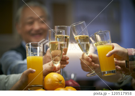 elderly asian man having a toast at dinner 120517958