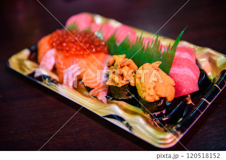 uni sushi with maguro sushi and salmon sushi set on desk, japanese food uni sushi with maguro sushi and salmon sushi set on desk, japanese food 120518152