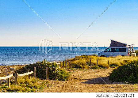 Camper van with roof top tent camp on beach Camper van with roof top tent camp on beach 120521221