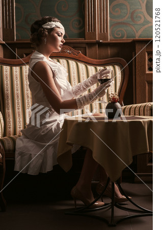 Beautiful blond woman drinking red wine.make-up.red lips.wineglass Beautiful blond woman drinking red wine.make-up.red lips.wineglass 120521768