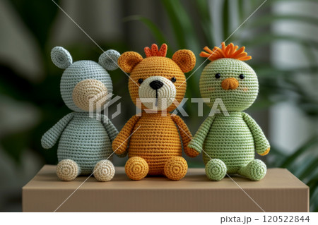 Funny amigurumi toys made in Japanese style sit on a packaging box for sending to the buyer Funny amigurumi toys made in Japanese style sit on a packaging box for sending to the buyer 120522844