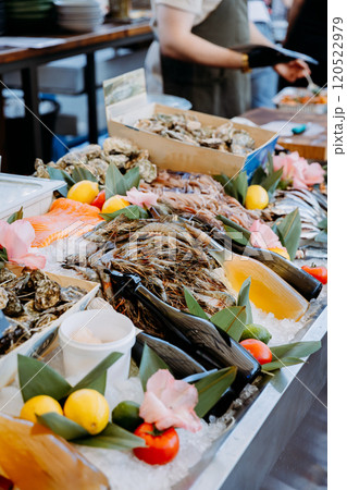 Luxury seafood buffet with fresh oysters, shrimp, and salmon, beautifully displayed on ice 120522979