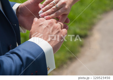 Diverse couple holding hands outdoors, with copy space. 120523450