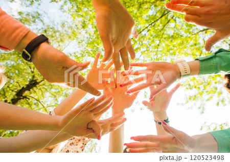 Hands of young people in the nature 120523498