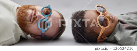 Header image of little Black boy typing on laptop keyboard writing homework task or playing video game while sitting at desk in bedroom, copy space 120524216