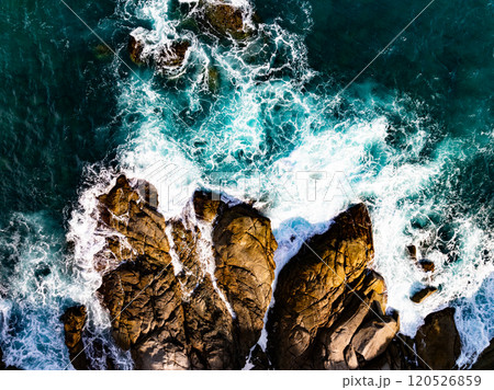 Aerial view of waves crashing on rocks,Seascape view ocean waves image for nature background and travel background Aerial view of waves crashing on rocks,Seascape view ocean waves image for nature background and travel background 120526859