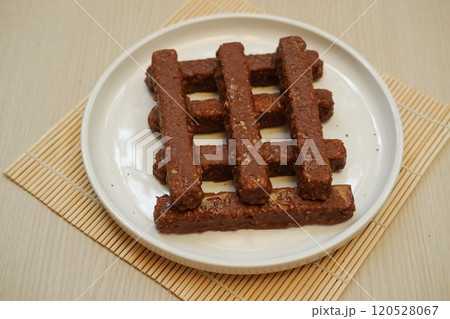 Chocolate wafers on a white plate, close-up 120528067