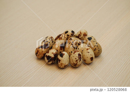 Quail eggs on a wooden table. Close-up, selective focus Quail eggs on a wooden table. Close-up, selective focus 120528068