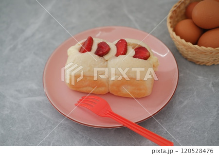 Strawberry cheese cake on a table. 120528476