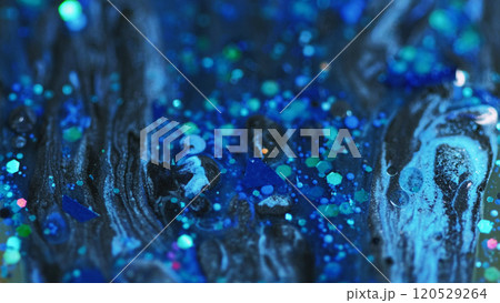 Acrylic paint mix. Wet glitter spill. Defocused blue black color sparkling sequin particles water liquid gloss emulsion ink drip abstract art background. 120529264