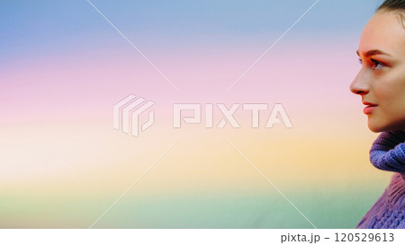 Calm faith. Determined girl. Enlightenment tranquility. Profile of young smiled confident woman on blur rainbow gradient colorful empty space background. Calm faith. Determined girl. Enlightenment tranquility. Profile of young smiled confident woman on blur rainbow gradient colorful empty space background. 120529613