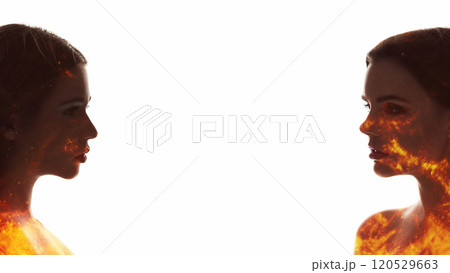 Fantasy couple portrait. Female sensuality. Orange sparks in woman silhouettes double exposure isolated on white copy space background. Fantasy couple portrait. Female sensuality. Orange sparks in woman silhouettes double exposure isolated on white copy space background. 120529663